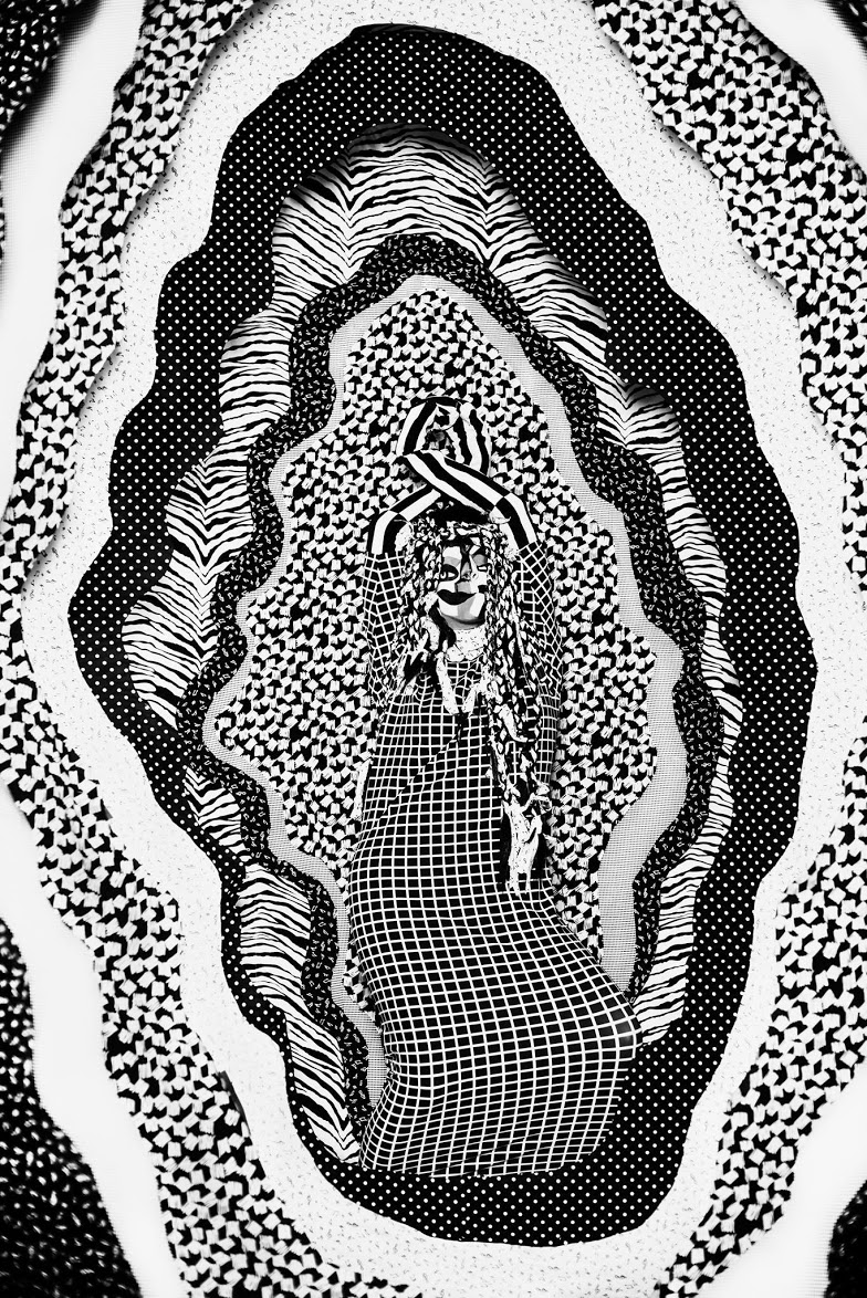 Haiiileen performing in Hypnotic (2016), a black-and-white optical performance installation exploring sound and movement.