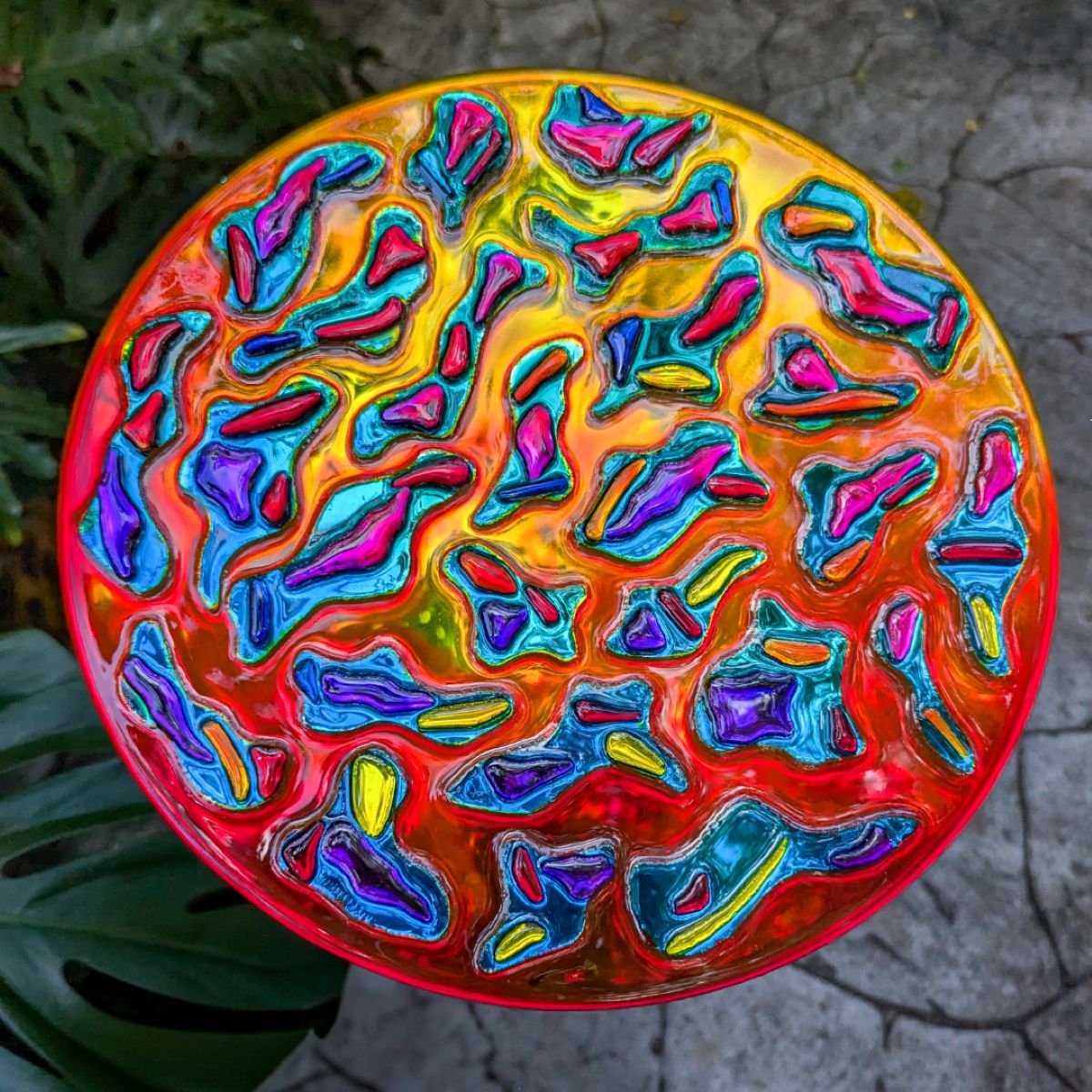 Spectral Resonance glass artwork by Haiiileen (2024), circular sculpture in vibrant diffraction colors.
