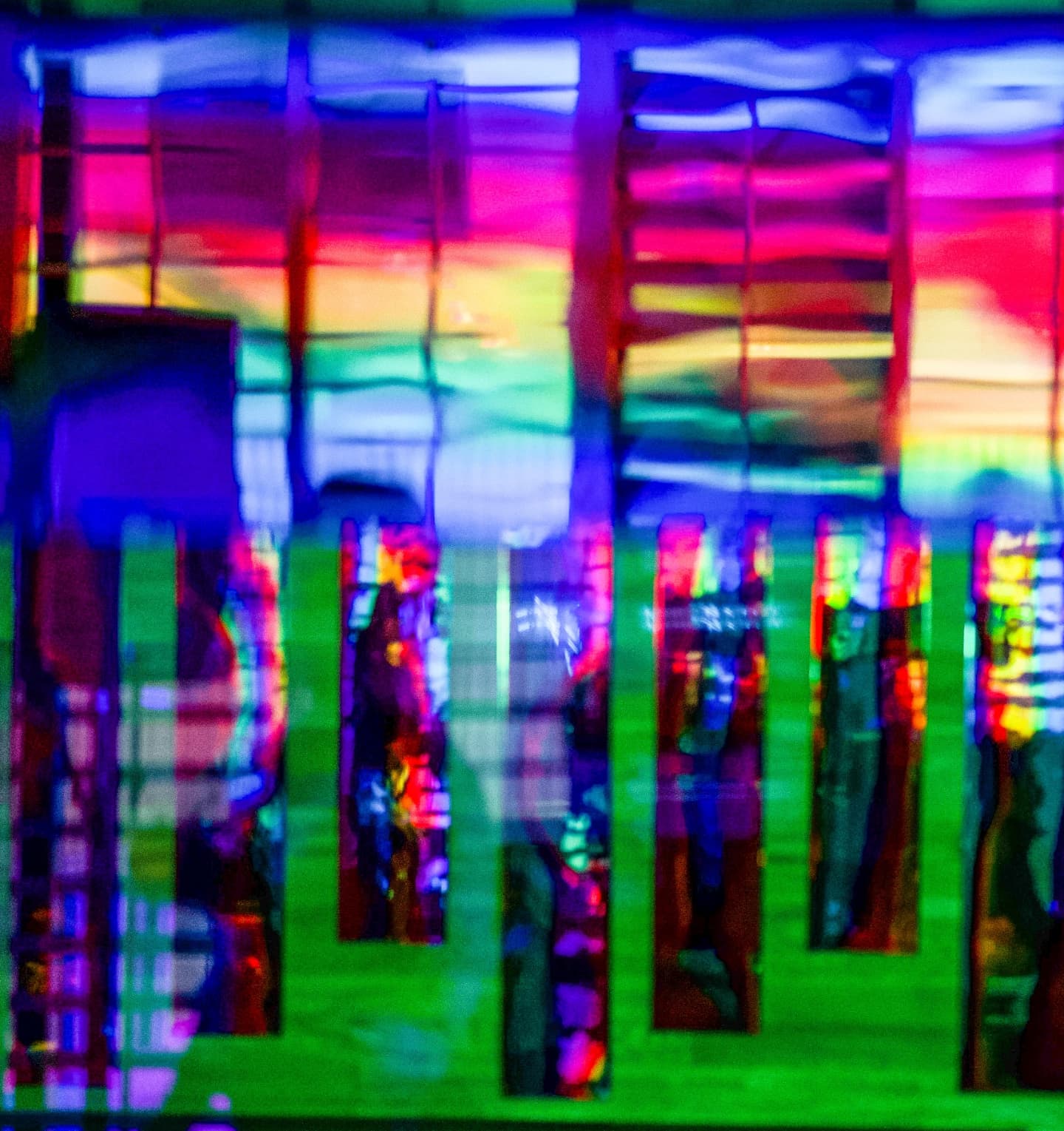Wall-mounted installation of iridescent rainbow-painted panels by Haiiileen at The Edition Hotel during Miami Art Week 2021.