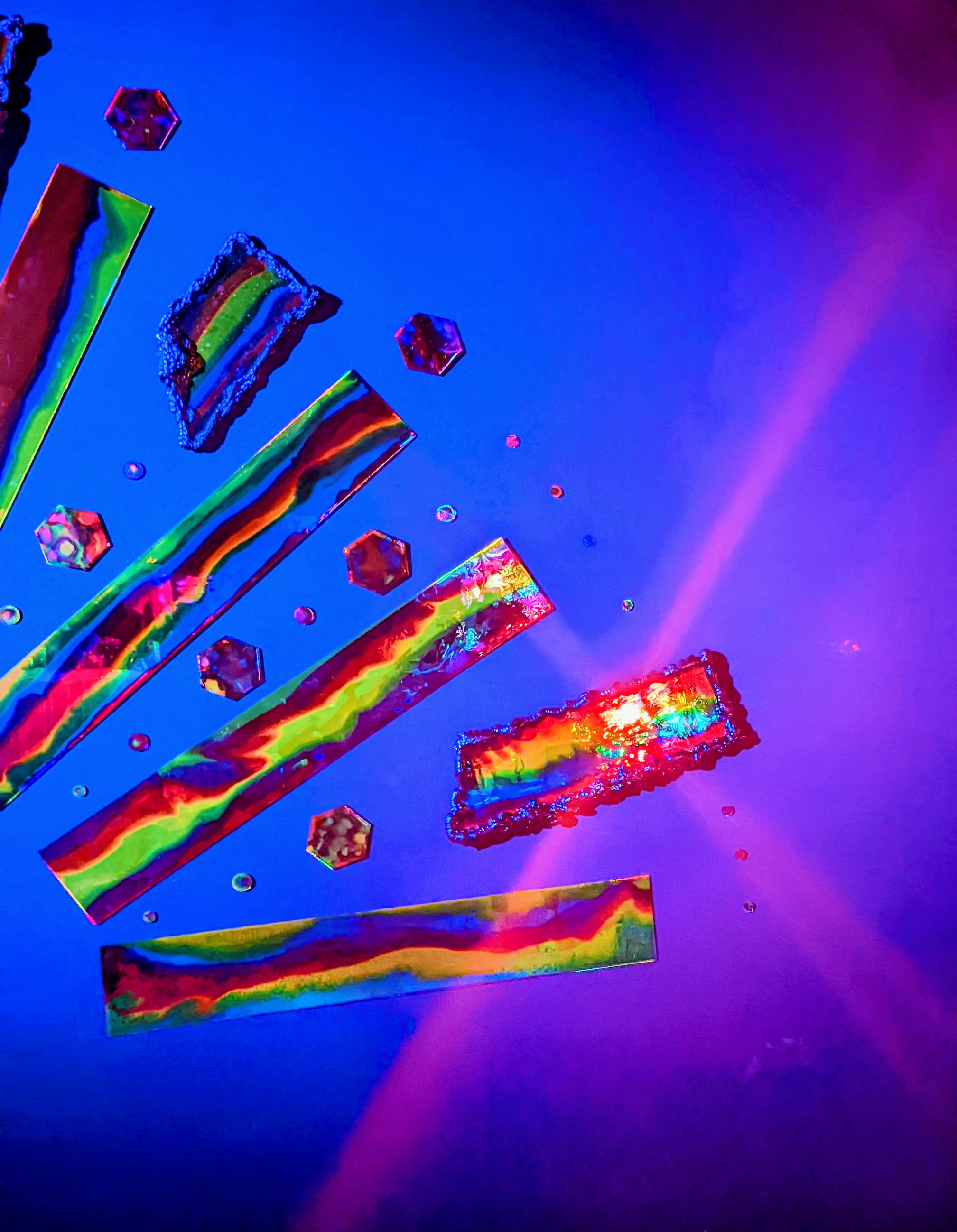 Haiii-Liiight (2021) by Haiiileen at Soho Beach House Miami — a radiant arc of reflective resin sculptures glowing in ultraviolet light for a New Year’s Eve installation.